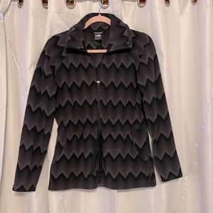 The North Face fleece jacket. Size M. Black and Gray zig zag pattern.